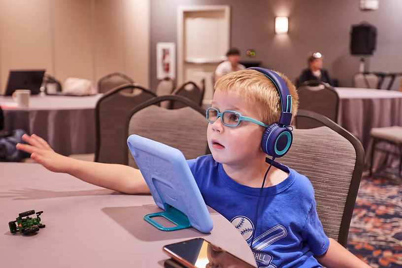 Issac Soul, who has HNRNPQ-NDD or SYCRIP, multitasking at 2024 conference